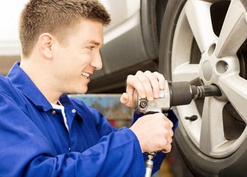 mechanic working on car