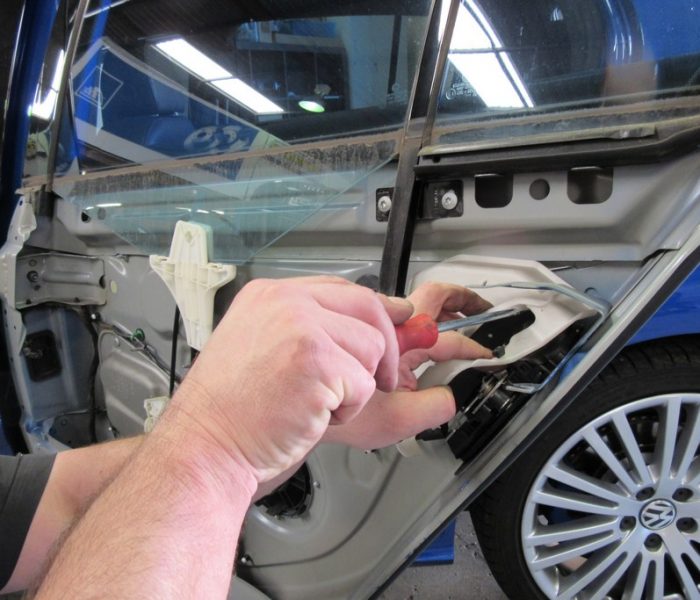 mechanic working on car
