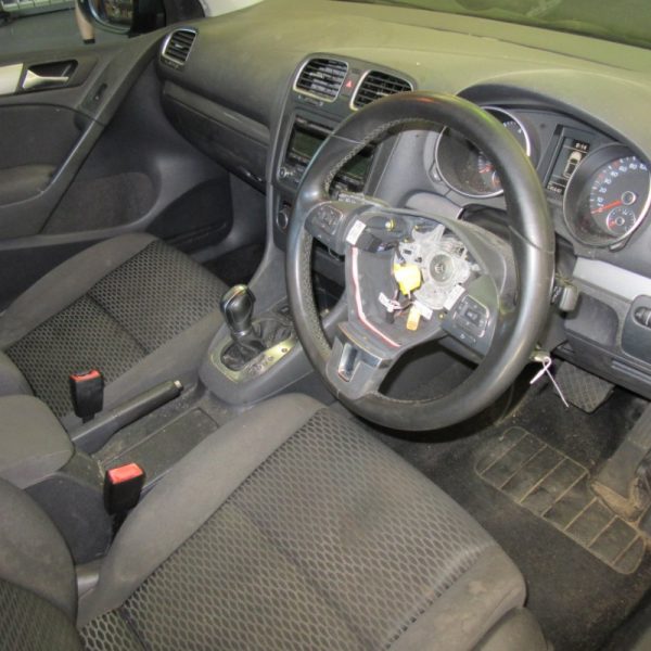 An old car's interior seats and dashboard