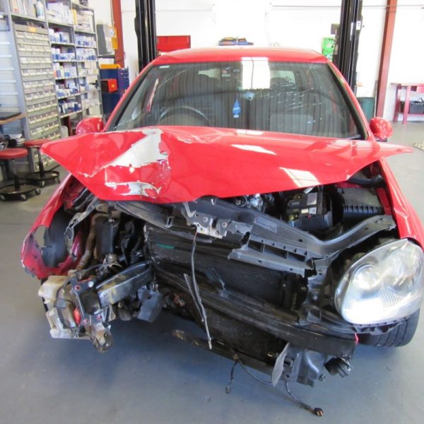 A red Volkswagen Golf GTI MK5 2008 car being wrecked