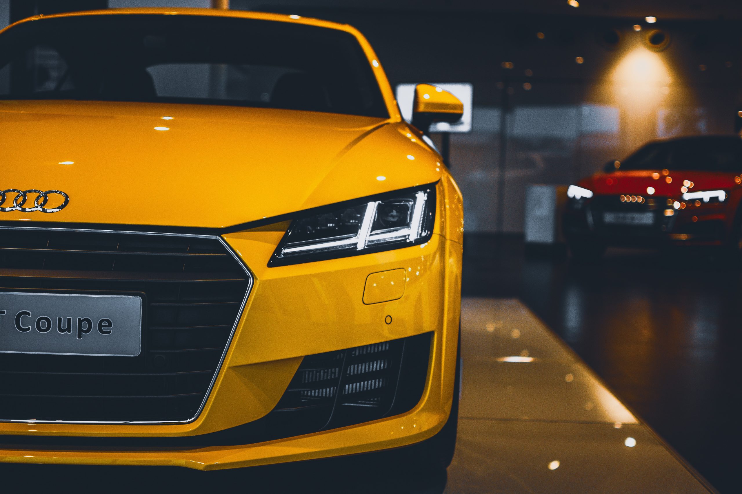 Yellow audi car at a dealership