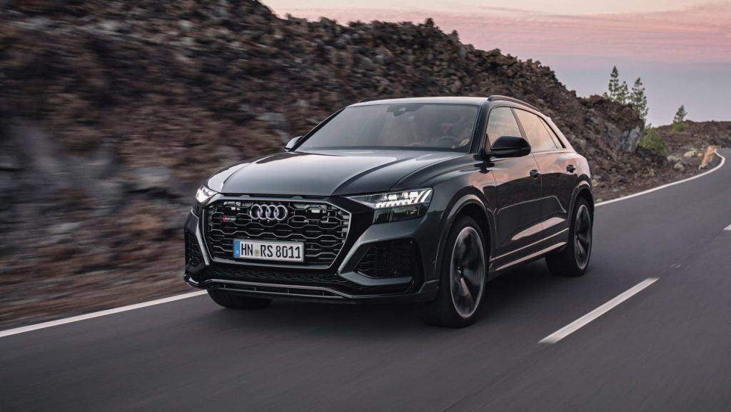 Audi car on road with sunset in background